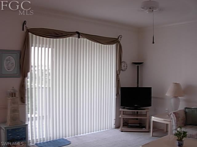 14081 Brant Point Circle, Unit 537 Fort Myers, FL 33919 - Photo 11 of 23 a living room with furniture and a flat screen tv