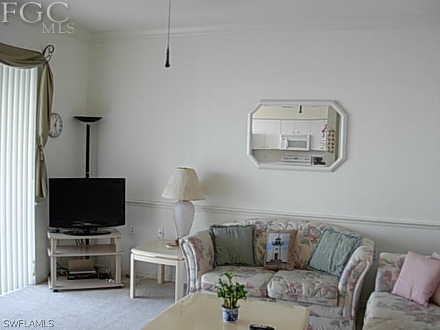 14081 Brant Point Circle, Unit 537 Fort Myers, FL 33919 - Photo 12 of 23 a living room with furniture and a flat screen tv