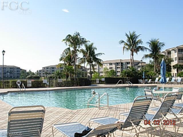 14081 Brant Point Circle, Unit 537 Fort Myers, FL 33919 - Photo 17 of 23 a view of a lake with couches and wooden floor