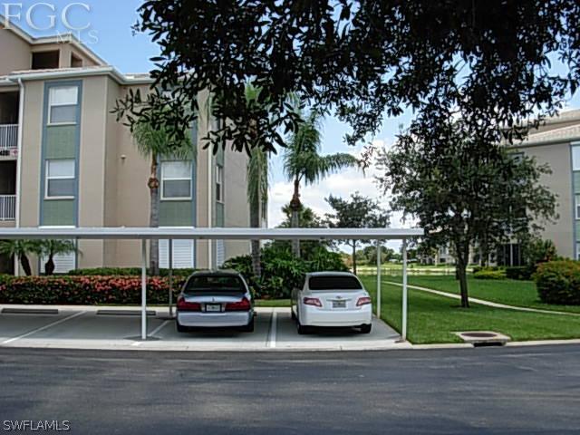 14081 Brant Point Circle, Unit 537 Fort Myers, FL 33919 - Photo 2 of 23 a car parked on the side of the road