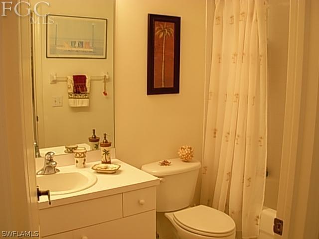 14081 Brant Point Circle, Unit 537 Fort Myers, FL 33919 - Photo 5 of 23 a bathroom with a sink a toilet and shower
