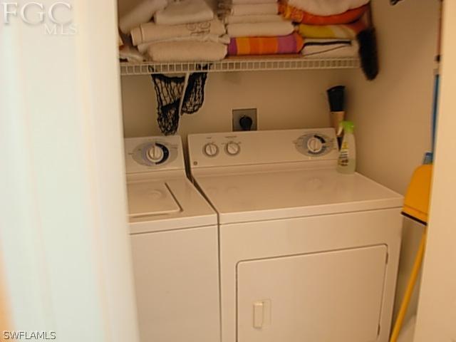 14081 Brant Point Circle, Unit 537 Fort Myers, FL 33919 - Photo 6 of 23 a utility room with dryer and washer