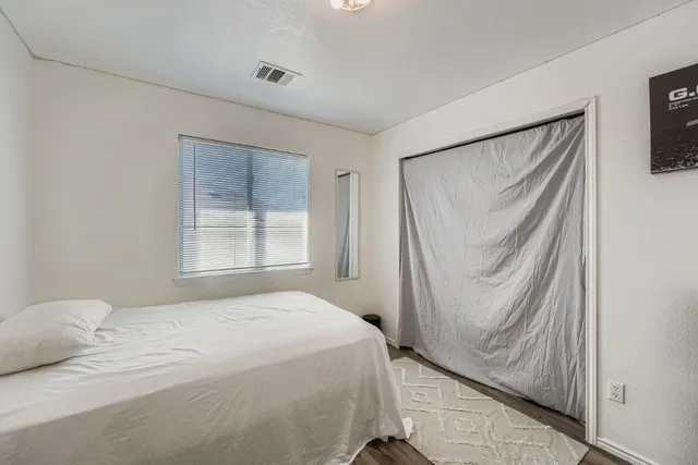 a bathroom with a double vanity sink mirror and toilet