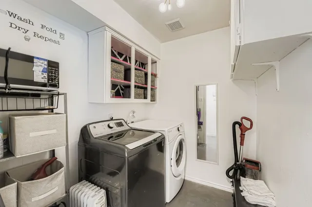 a bathroom with a sink a toilet and a shower