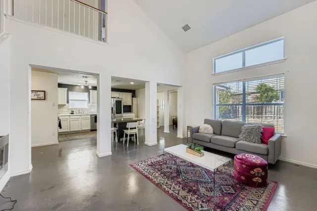 a living room with furniture and a rug