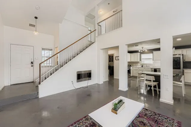 a living room with furniture and a table