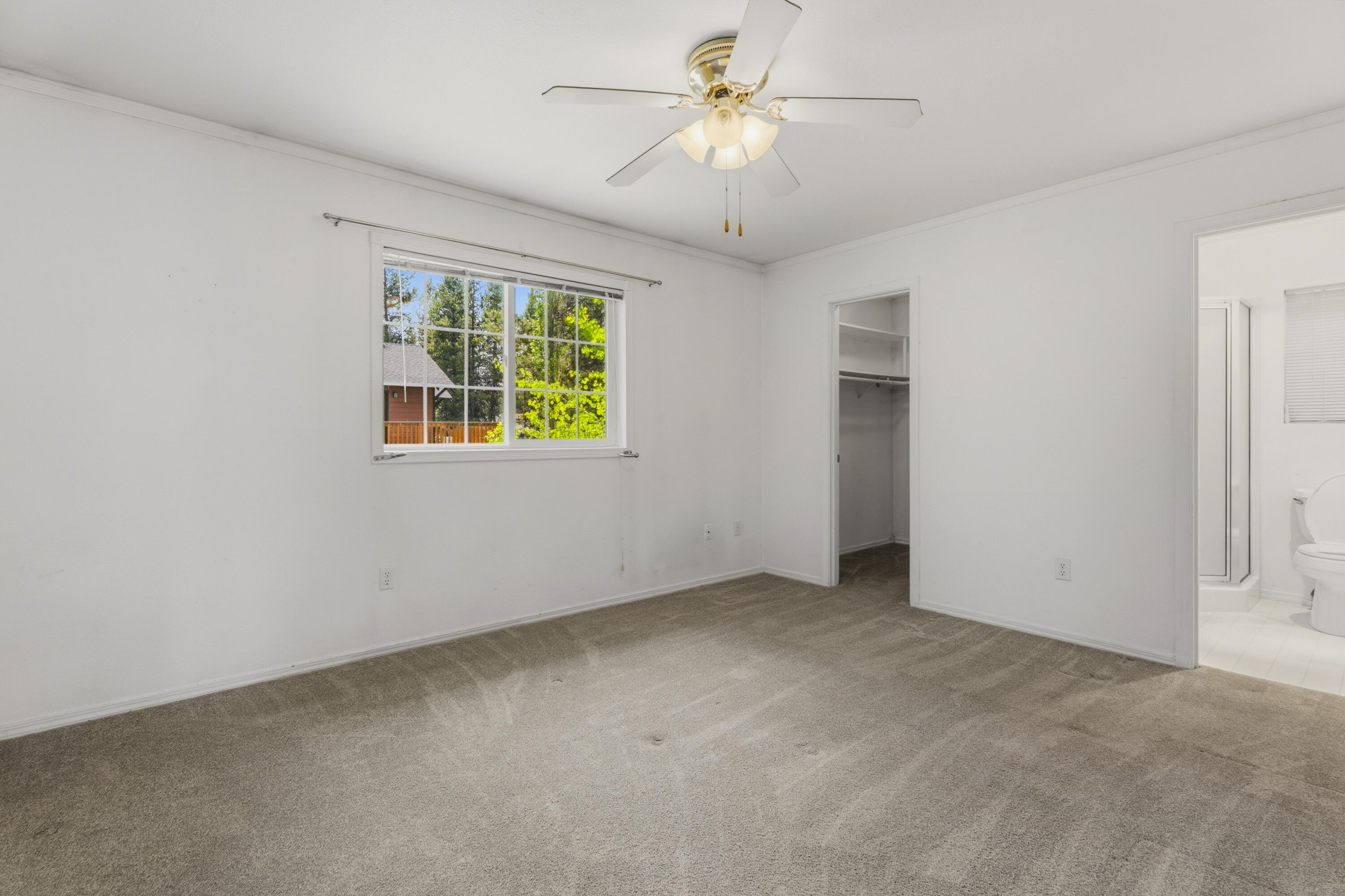 55885 Osprey Road Bend, OR 97707 - Photo 14 of 58 Wide primary bedroom with walk-in closet and private bathroom.