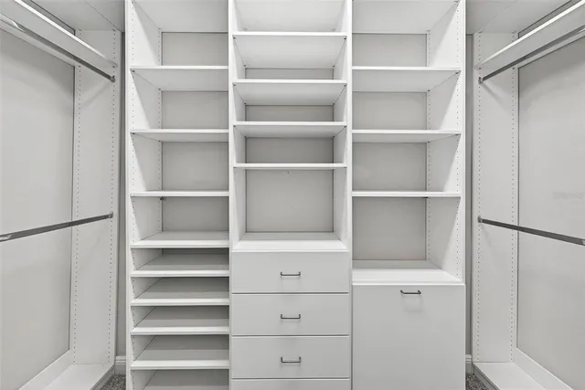 a view of an empty room with a balcony