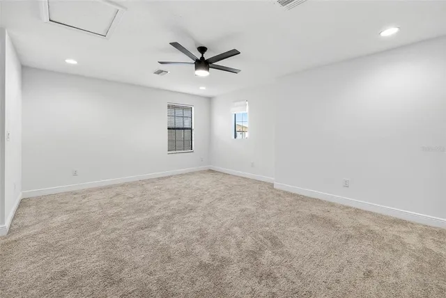 a view of a big room with furniture window and outside view