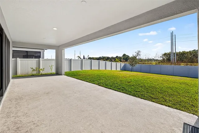 a view of a swimming pool with an outdoor seating
