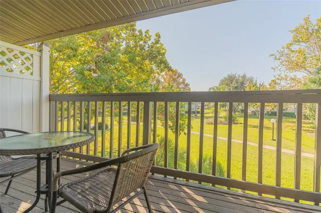 a view of balcony with furniture