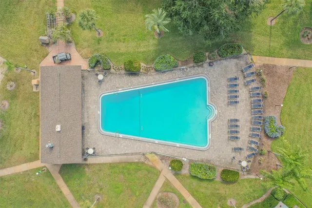 a view of a swimming pool with a patio