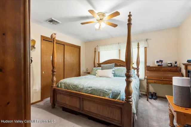 a bed room with a bed and a chandelier