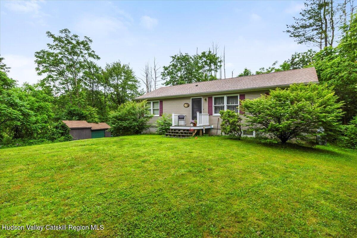 61 Travis Boulevard Catskill, NY 12414 - Photo 25 of 30 a view of house with backyard and garden