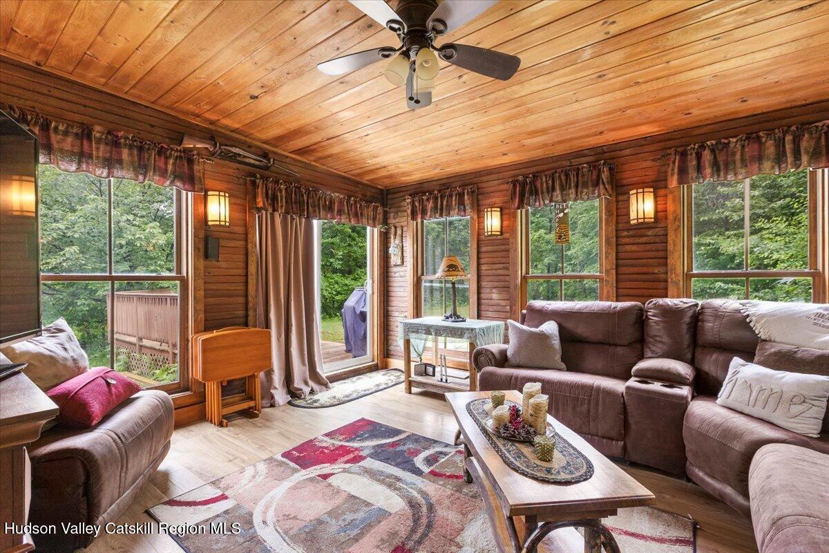 61 Travis Boulevard Catskill, NY 12414 - Photo 3 of 30 a living room with furniture and floor to ceiling windows