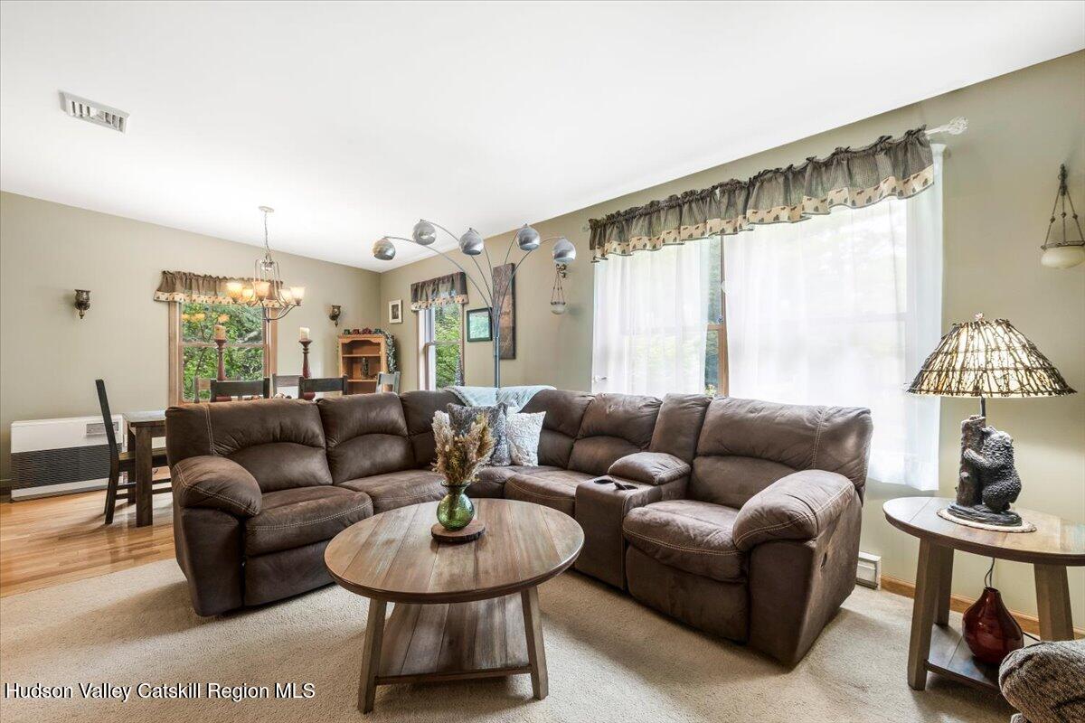 61 Travis Boulevard Catskill, NY 12414 - Photo 6 of 30 a living room with furniture and a large window