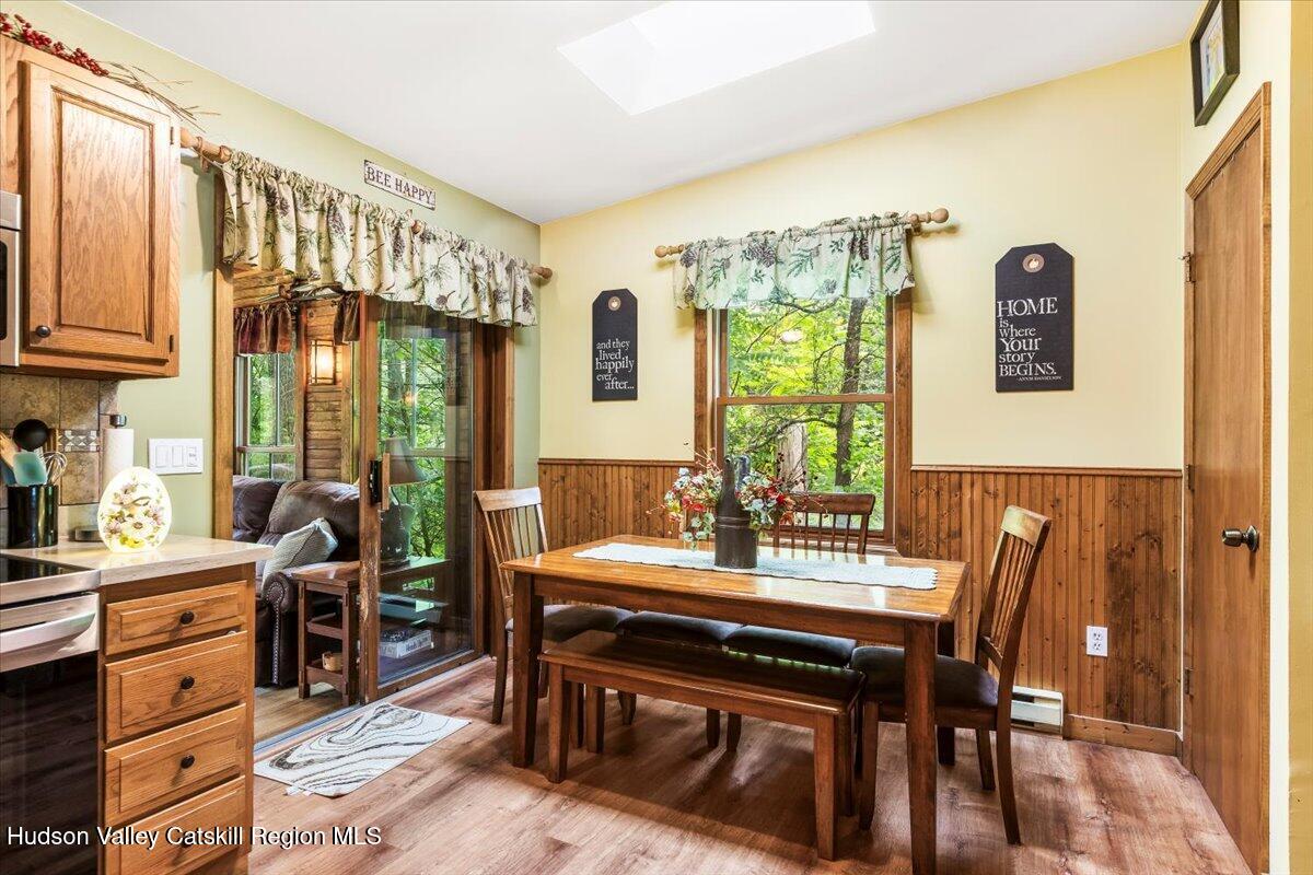 61 Travis Boulevard Catskill, NY 12414 - Photo 10 of 30 a view of a dining room with furniture window and wooden floor