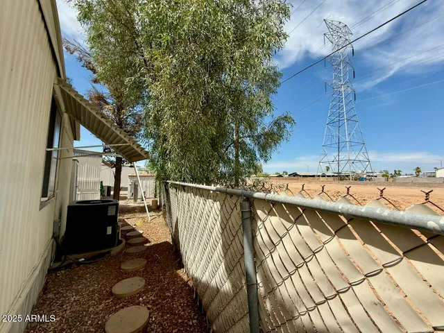 a view of balcony with wooden floor and seating space