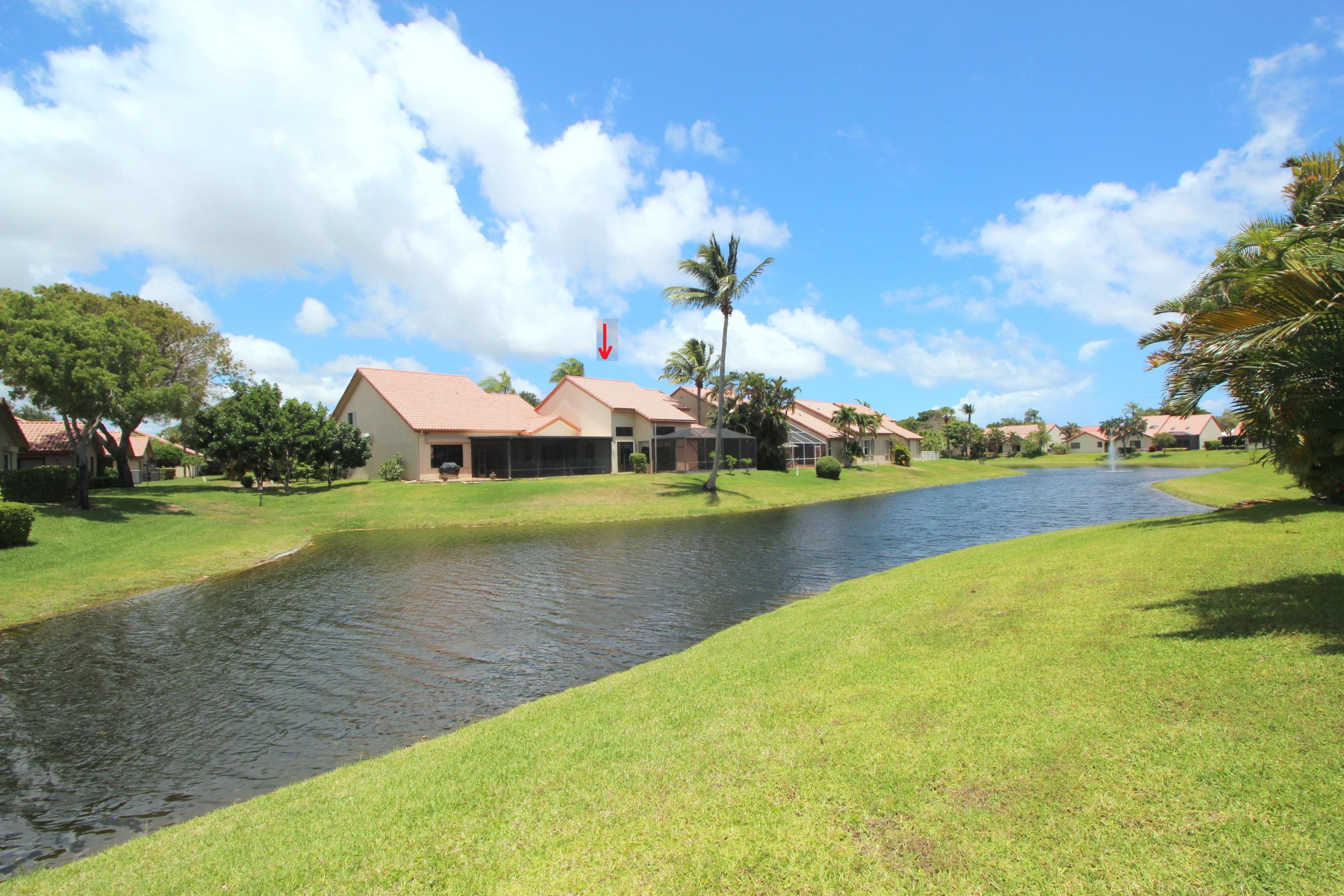 23475 Water Circle Boca Raton, FL 33486 - Photo 2 of 32 a view of a lake with houses