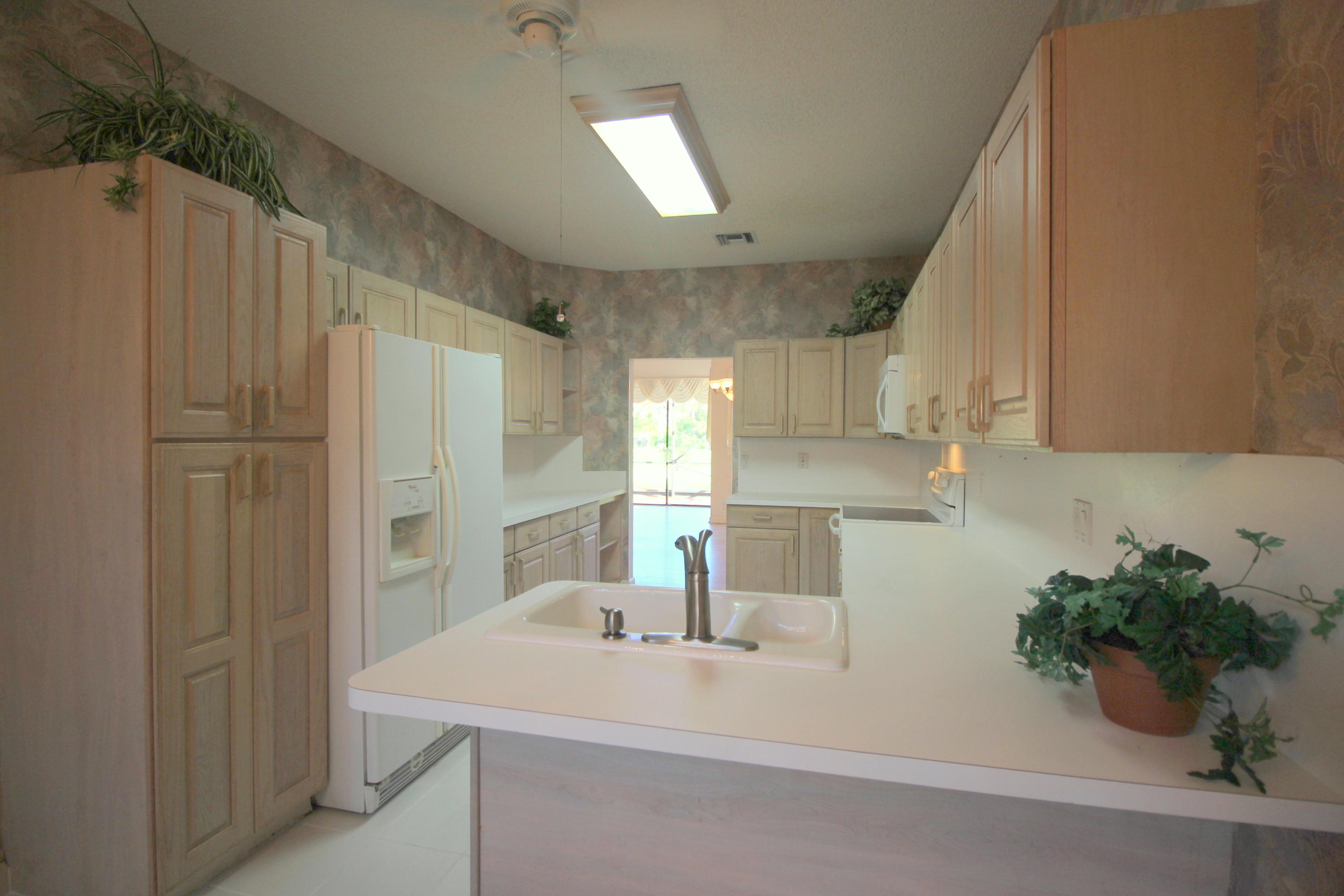 23475 Water Circle Boca Raton, FL 33486 - Photo 16 of 32 a bathroom with a sink a mirror and a shower