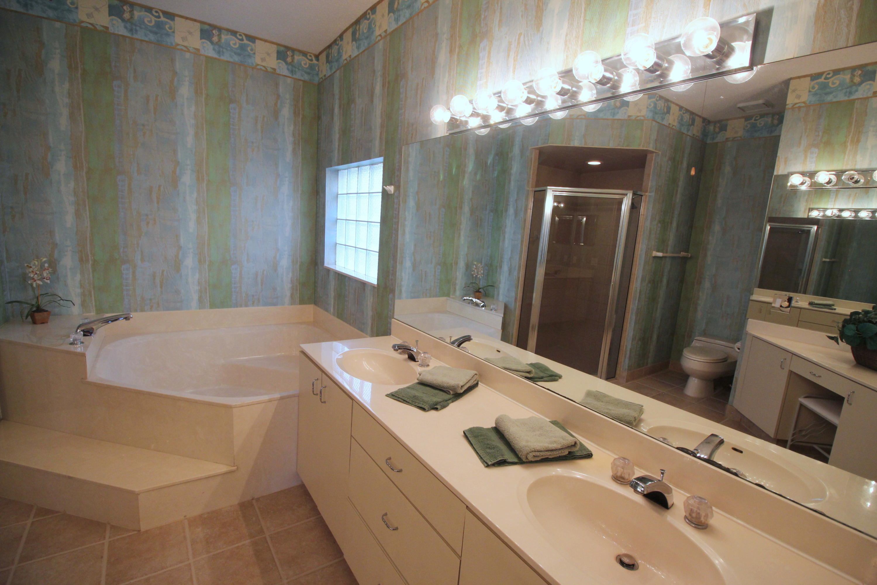 23475 Water Circle Boca Raton, FL 33486 - Photo 19 of 32 a bathroom with a sink and a mirror