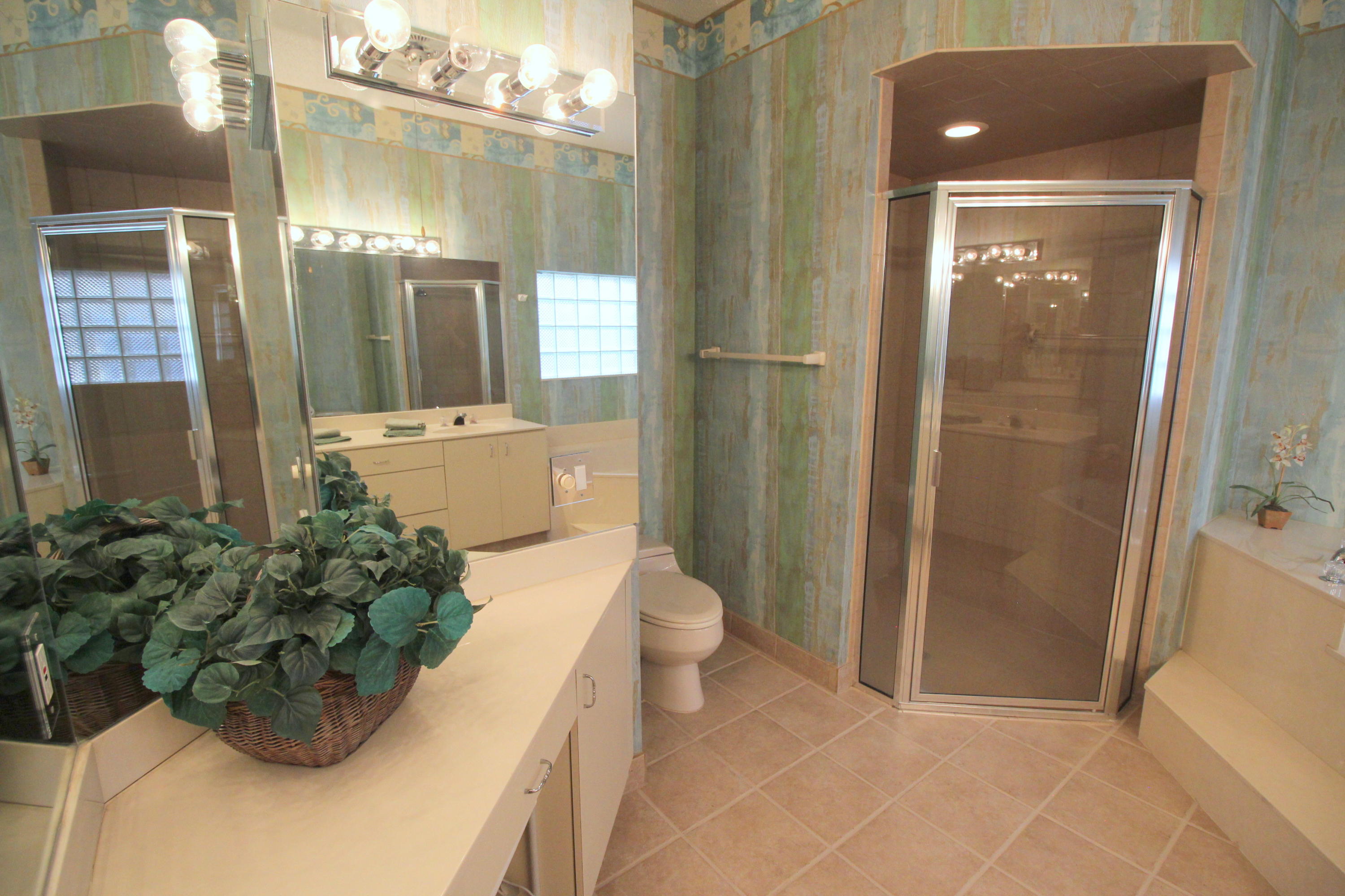 23475 Water Circle Boca Raton, FL 33486 - Photo 20 of 32 a bathroom with a sink a toilet and shower