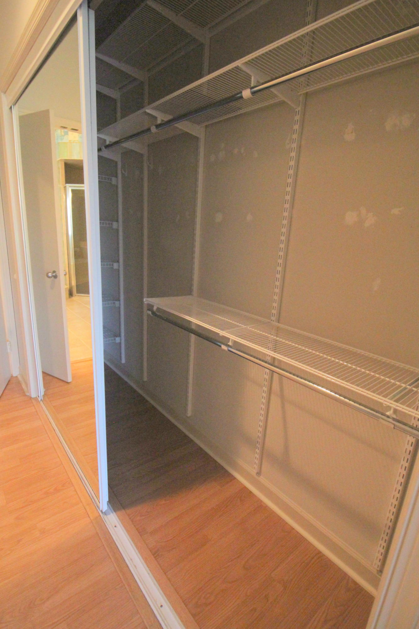 23475 Water Circle Boca Raton, FL 33486 - Photo 23 of 32 a view of walk in closet with empty racks