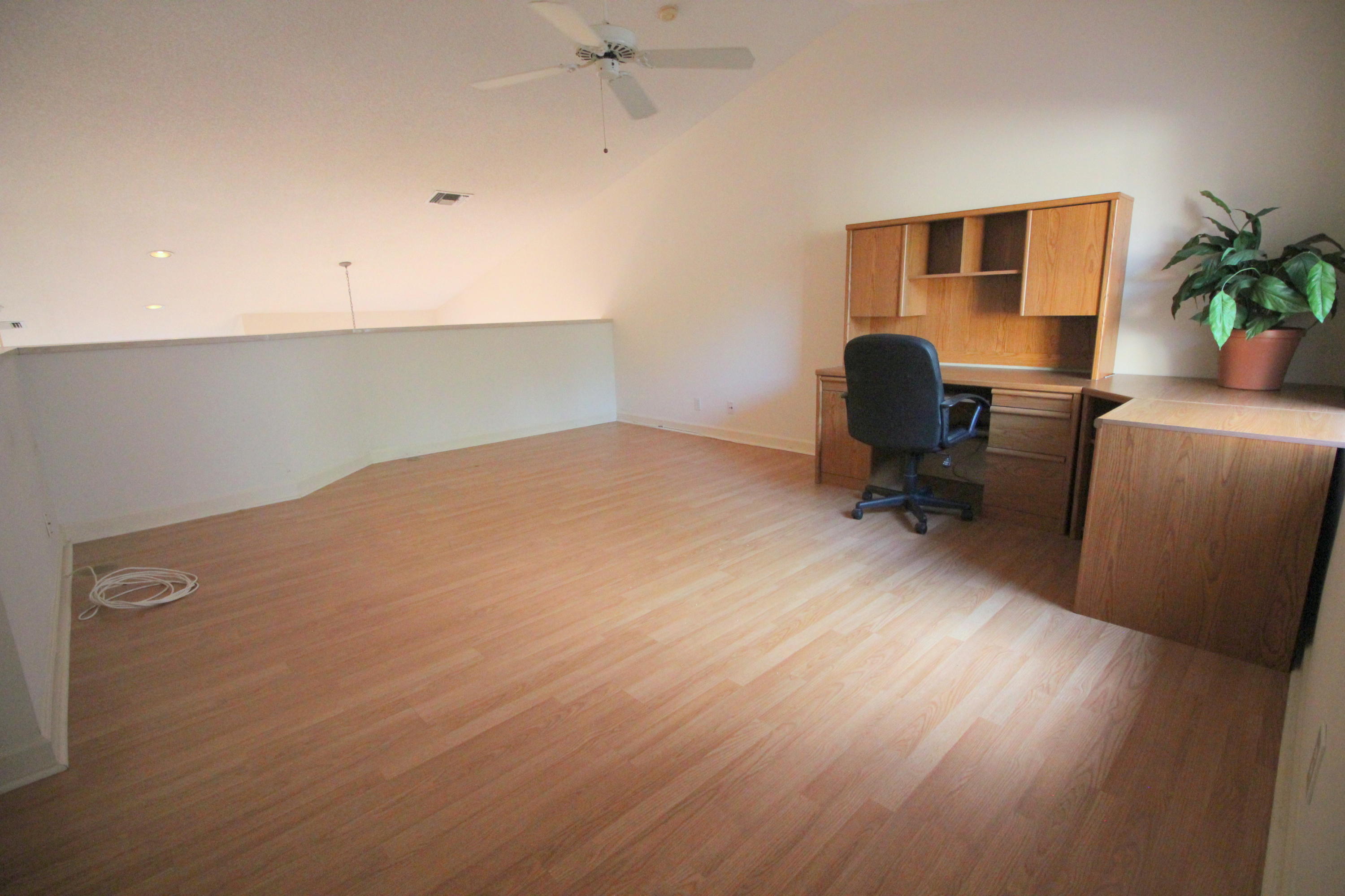 23475 Water Circle Boca Raton, FL 33486 - Photo 26 of 32 a workspace with furniture and wooden floor