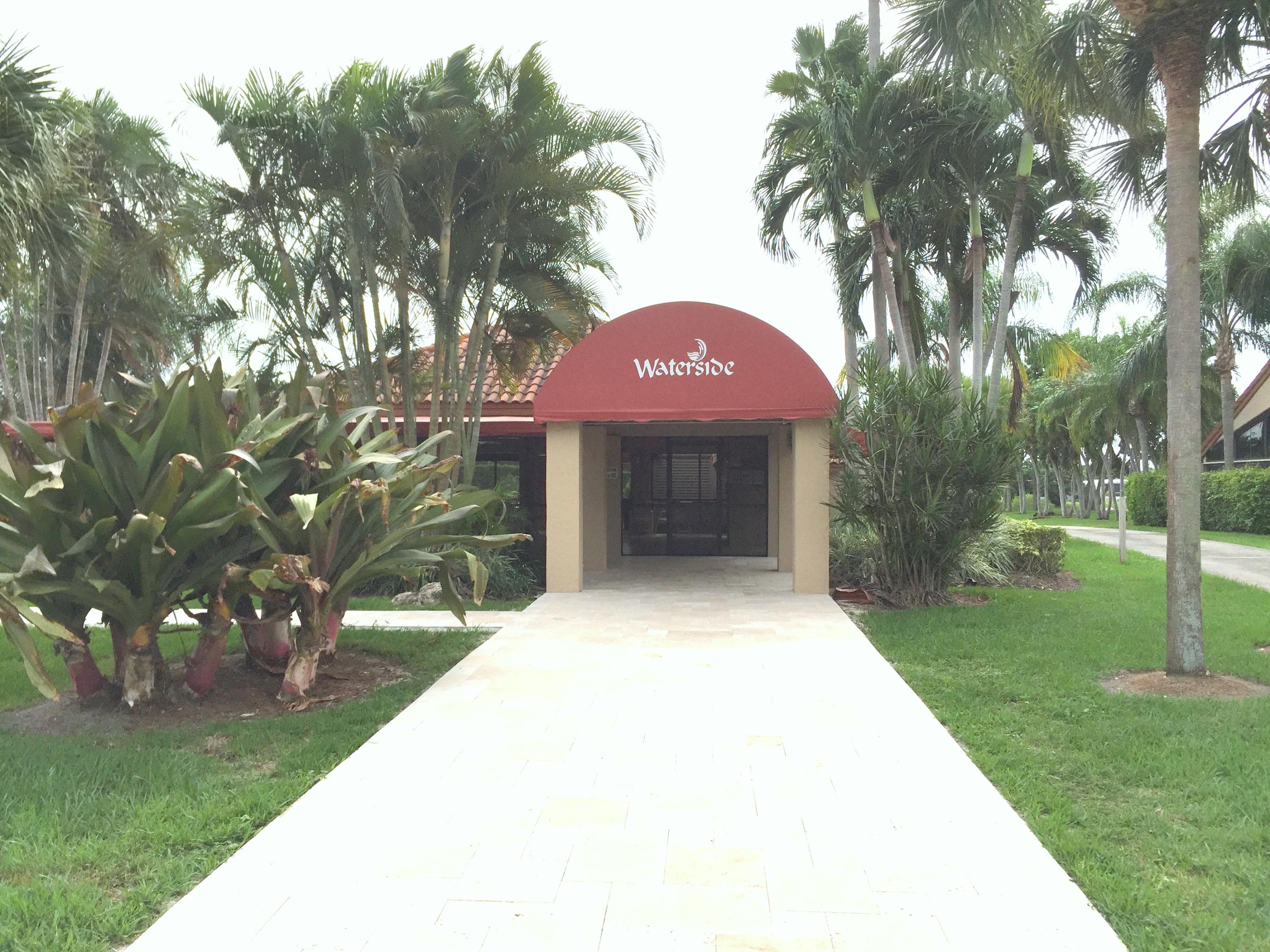 23475 Water Circle Boca Raton, FL 33486 - Photo 27 of 32 a front view of a house with a yard and tree