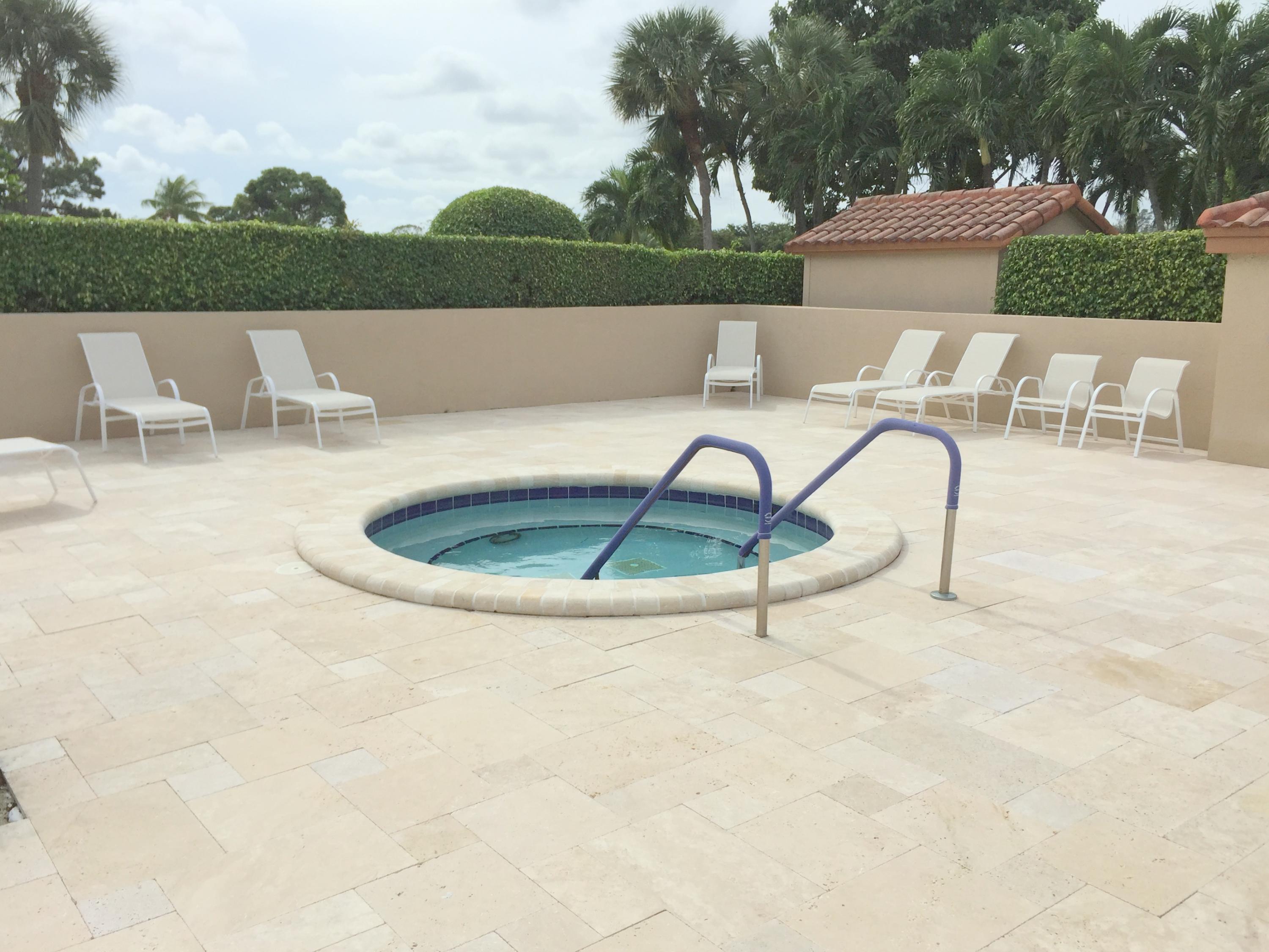 23475 Water Circle Boca Raton, FL 33486 - Photo 29 of 32 a view of a swimming pool with a lounge chair
