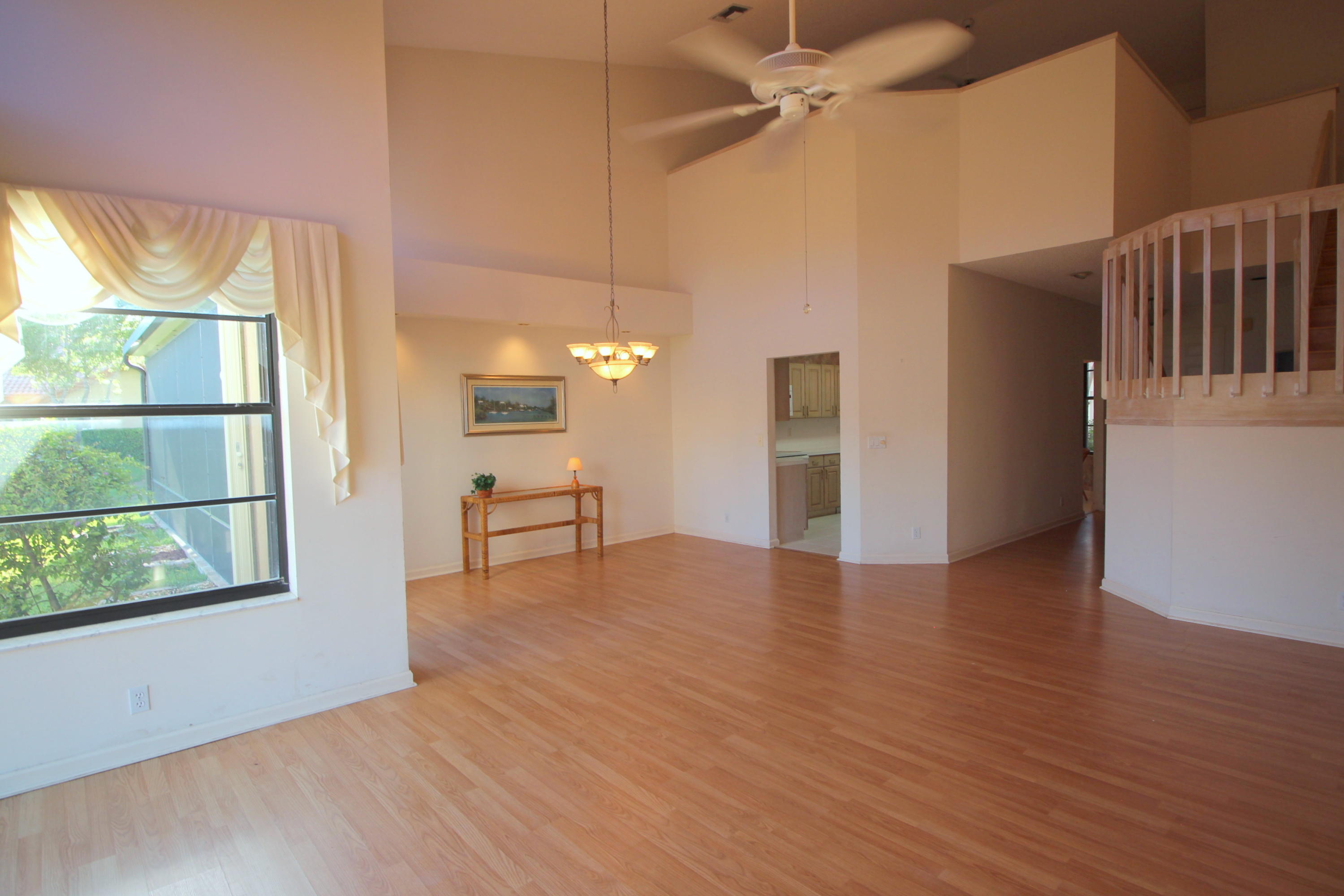 23475 Water Circle Boca Raton, FL 33486 - Photo 10 of 32 wooden floor in an empty room with a window