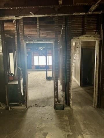 619 Frederick Street McKees Rocks, PA 15136 - Photo 4 of 11 an empty room with wooden floor and a bathroom