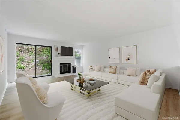 a living room with furniture fireplace and a flat screen tv