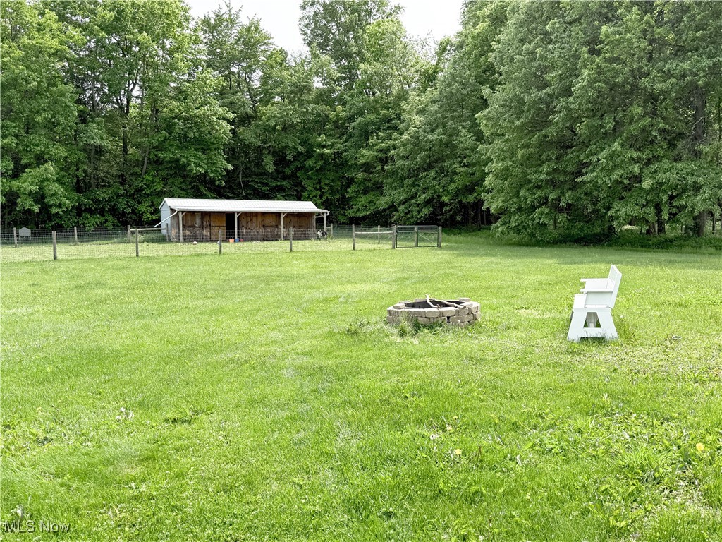 11737 Gladstone Road Warren, OH 44481 - Photo 35 of 41 View of yard with a fire pit