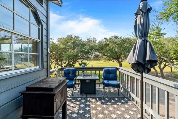 a view of a chairs and table in the balcony