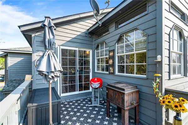 a group of people sitting in front of a house
