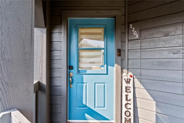 a view of a door and a window
