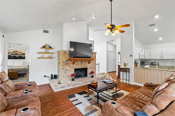 a living room with furniture fireplace and a flat screen tv