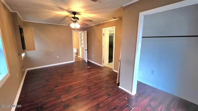 a view of livingroom with hardwood floor and a ceiling fan