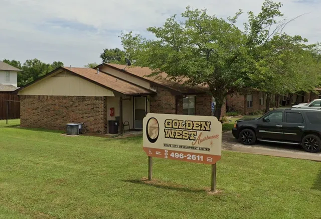 a sign on the side of the house