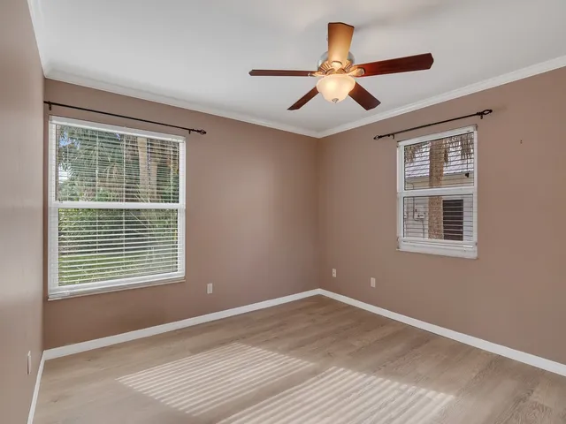 a view of a swimming pool with an outdoor seating and a yard