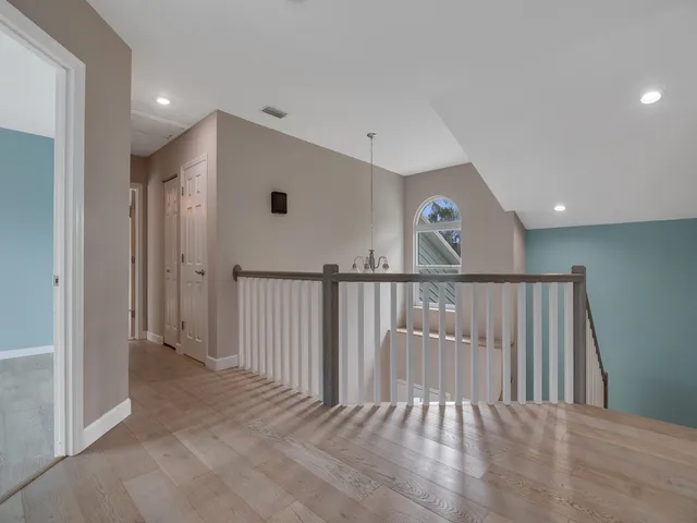 a view of a swimming pool with a lounge chairs