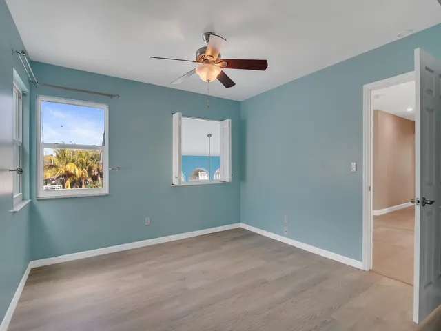 an aerial view of residential houses with outdoor space and swimming pool