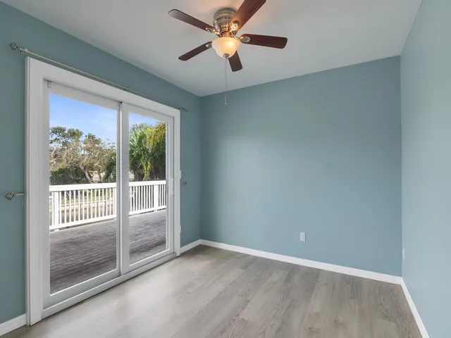 an aerial view of lake residential house with outdoor space and trees