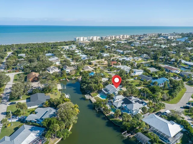 a view of staircase with railing and white walls