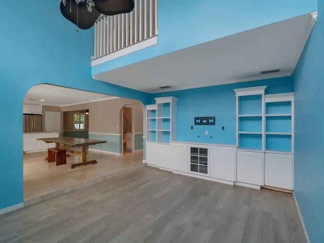 a kitchen with stainless steel appliances a sink a stove a refrigerator and cabinets