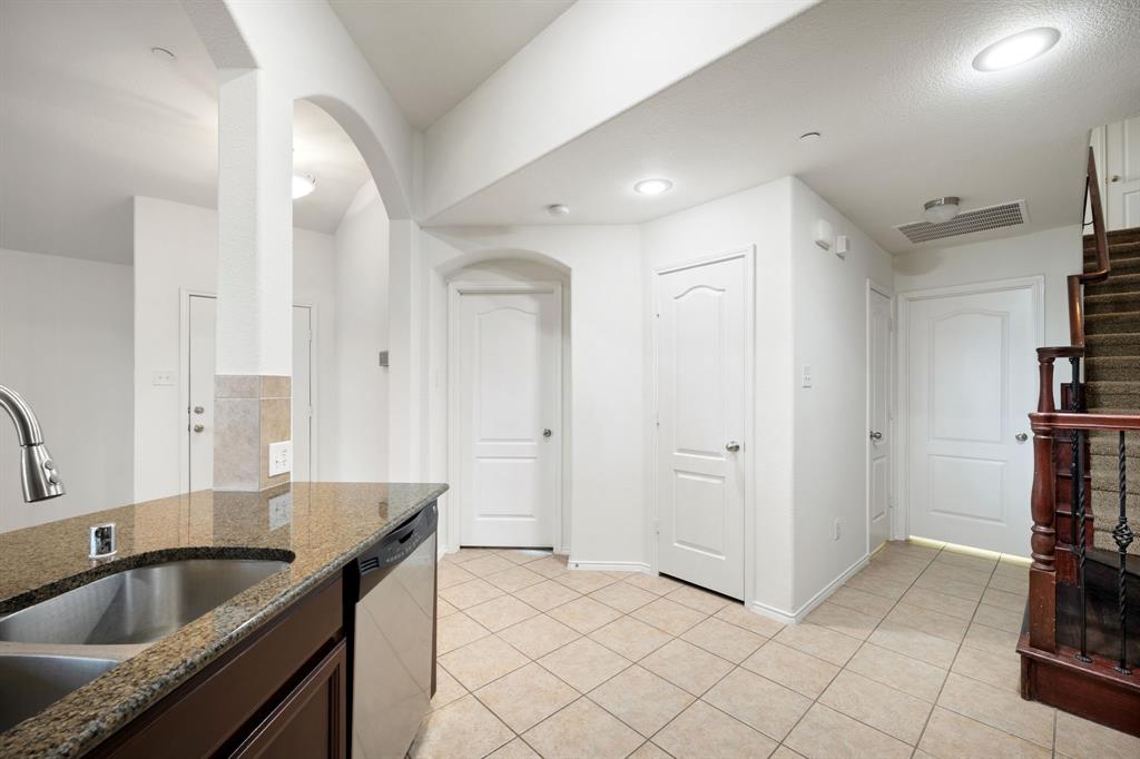 1013 Lucy Lane Allen, TX 75013 - Photo 15 of 30 a kitchen with a sink and a refrigerator