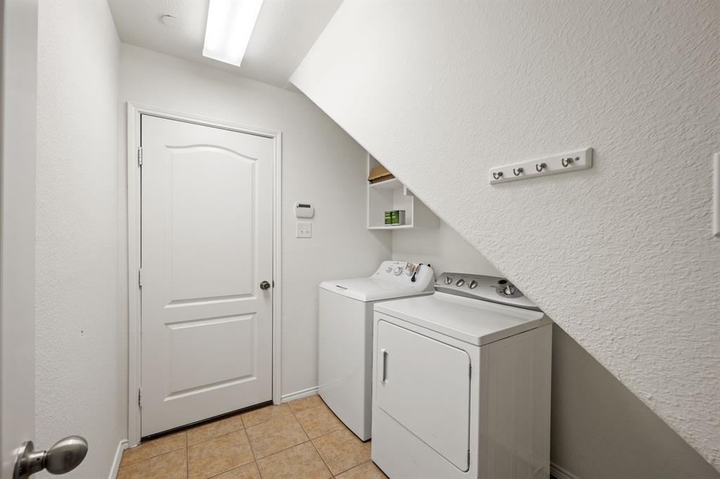 1013 Lucy Lane Allen, TX 75013 - Photo 17 of 30 a utility room with dryer and washer