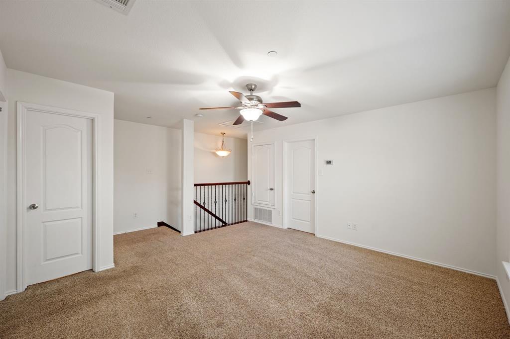 1013 Lucy Lane Allen, TX 75013 - Photo 18 of 30 a view of a chandelier in a room