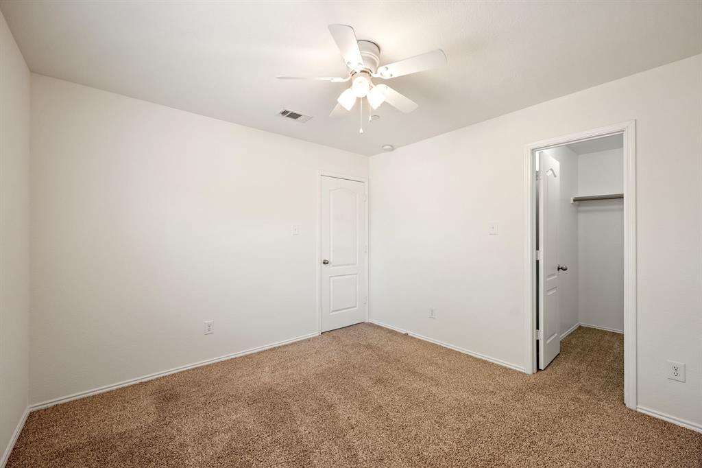 1013 Lucy Lane Allen, TX 75013 - Photo 19 of 30 an empty room with fan and fan